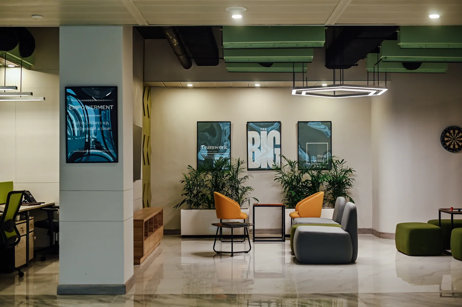 PSO House, 8th-floor rehabilitation, Karachi: Colourful lounge seating beside the working floor. 8th-floor rehabilitation photography.