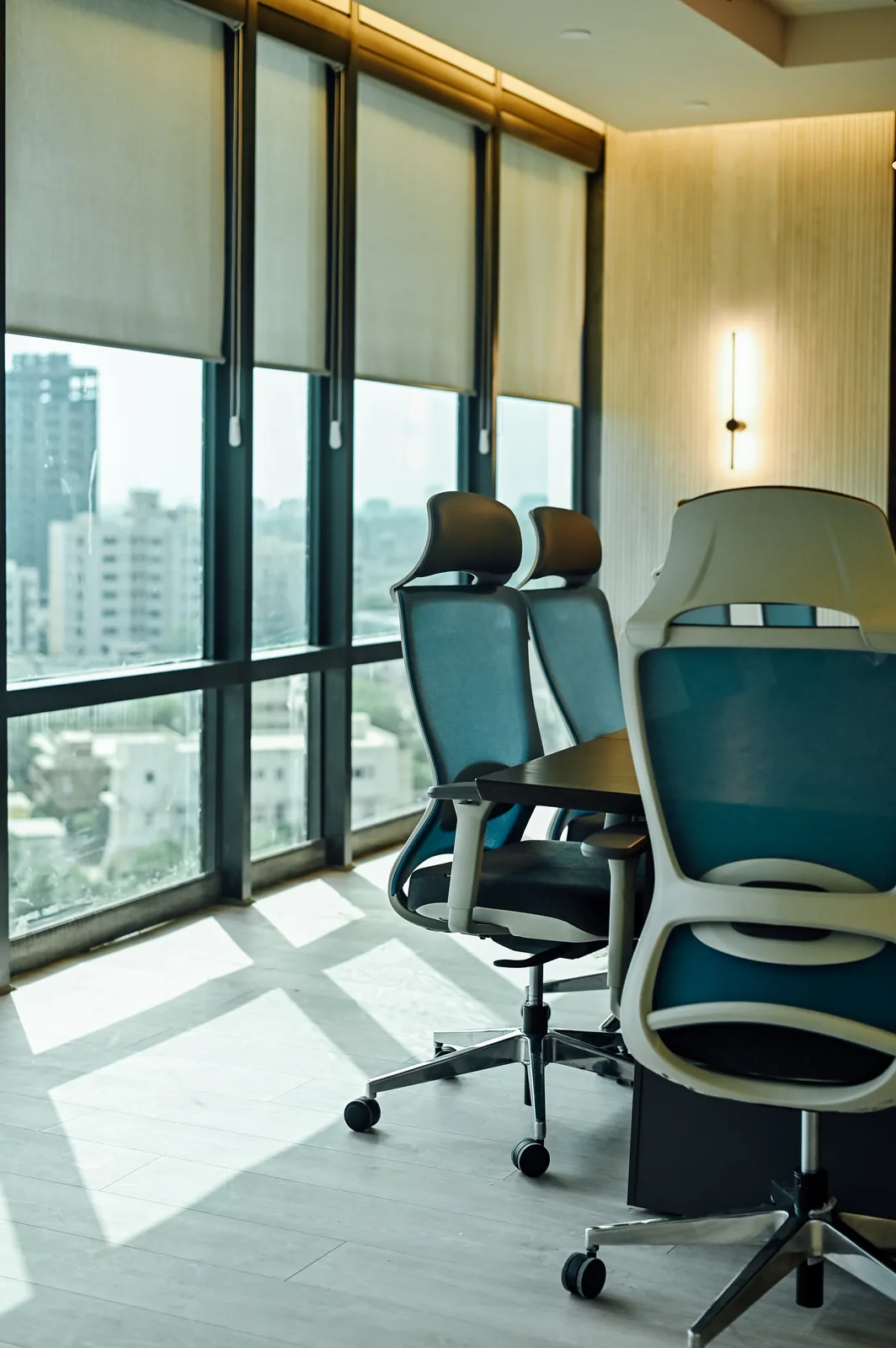 PSO House, 8th-floor rehabilitation, Karachi: Meeting chairs beside a bright city outlook. 8th-floor rehabilitation photography.