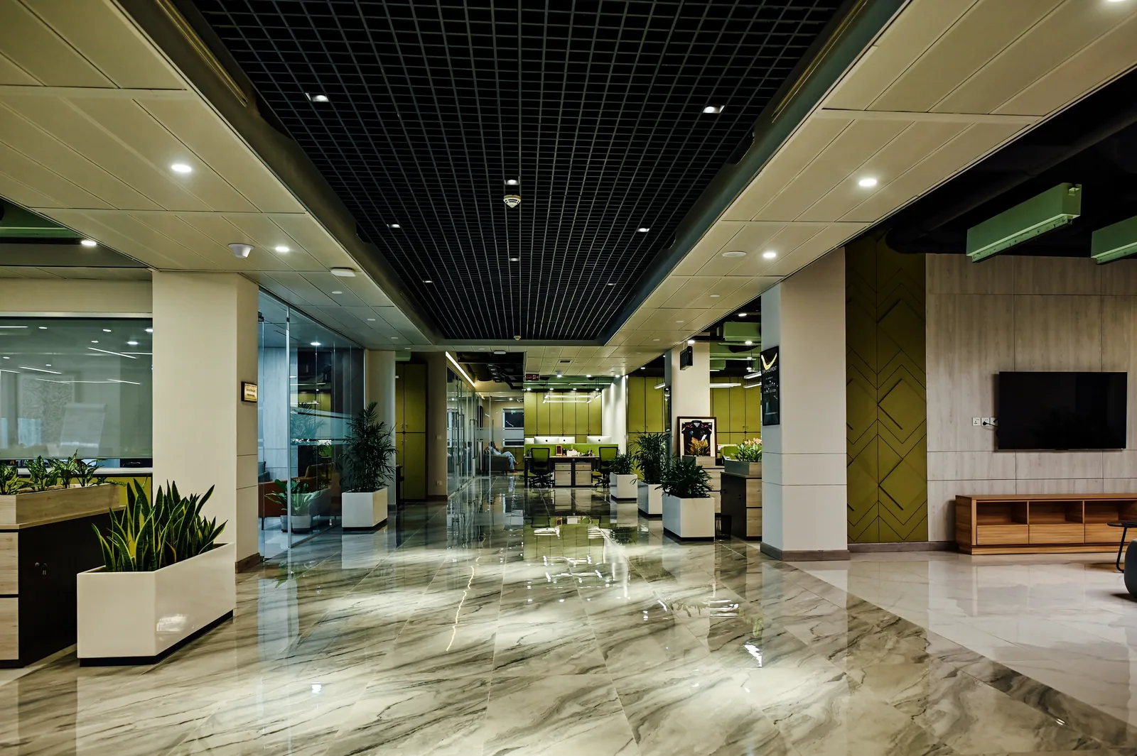 PSO House, 8th-floor rehabilitation, Karachi: A broad corridor links rooms, work bays and lounge space. 8th-floor rehabilitation photography.