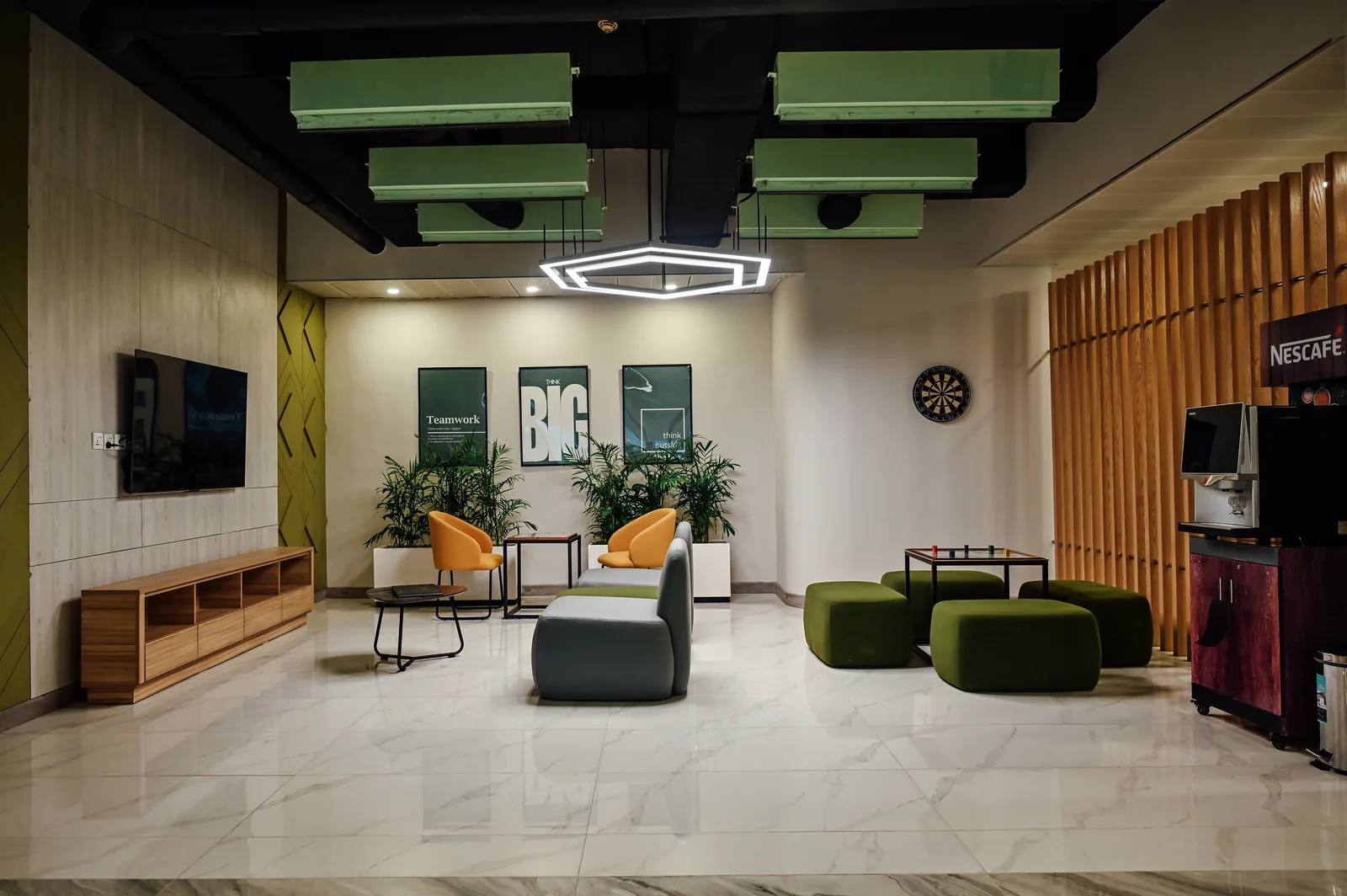 PSO House, 8th-floor rehabilitation, Karachi: A lounge brings seating, games and coffee together. 8th-floor rehabilitation photography.