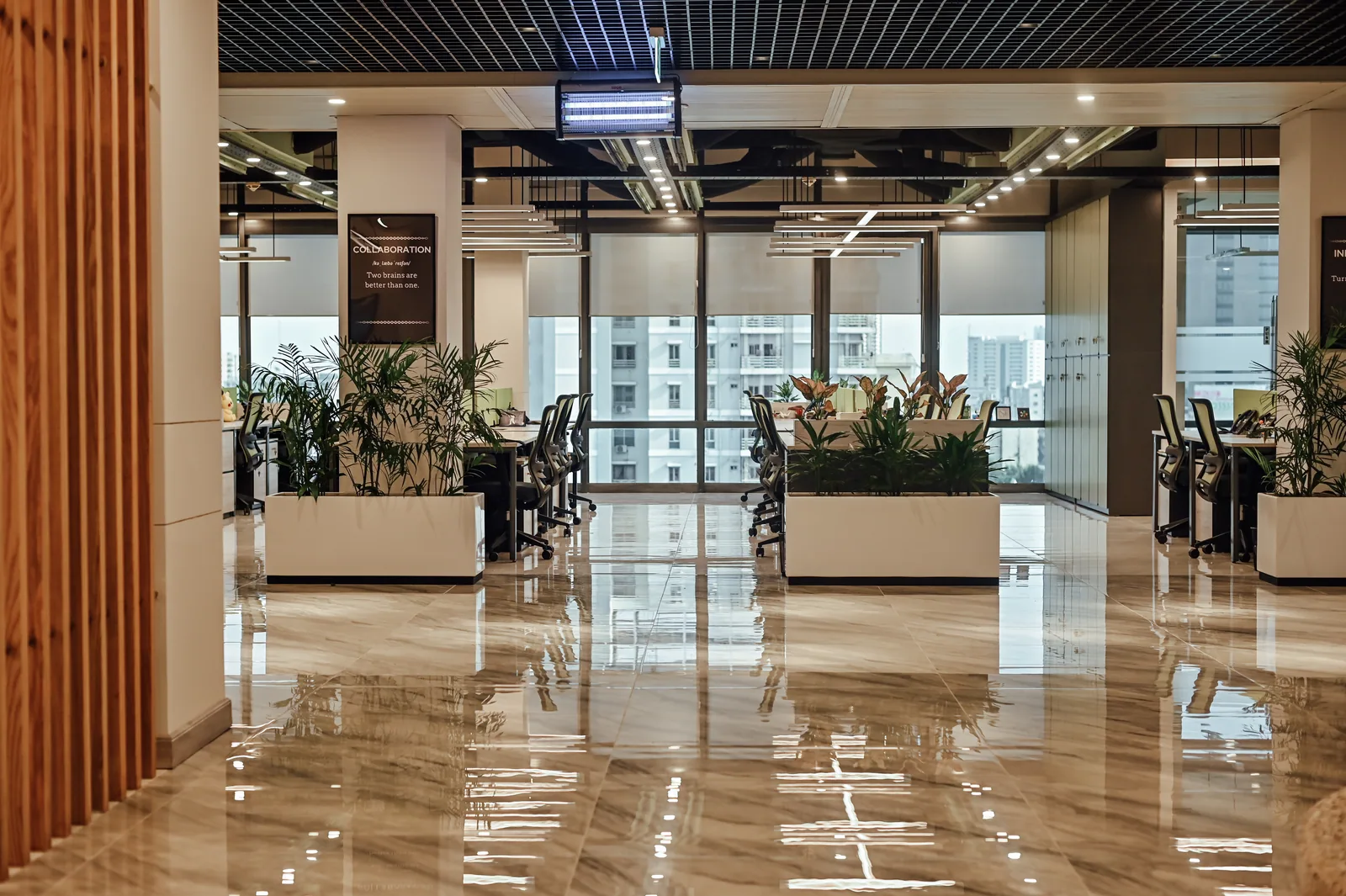PSO House, 8th-floor rehabilitation, Karachi: A timber screen opens onto the planted office floor. 8th-floor rehabilitation photography.