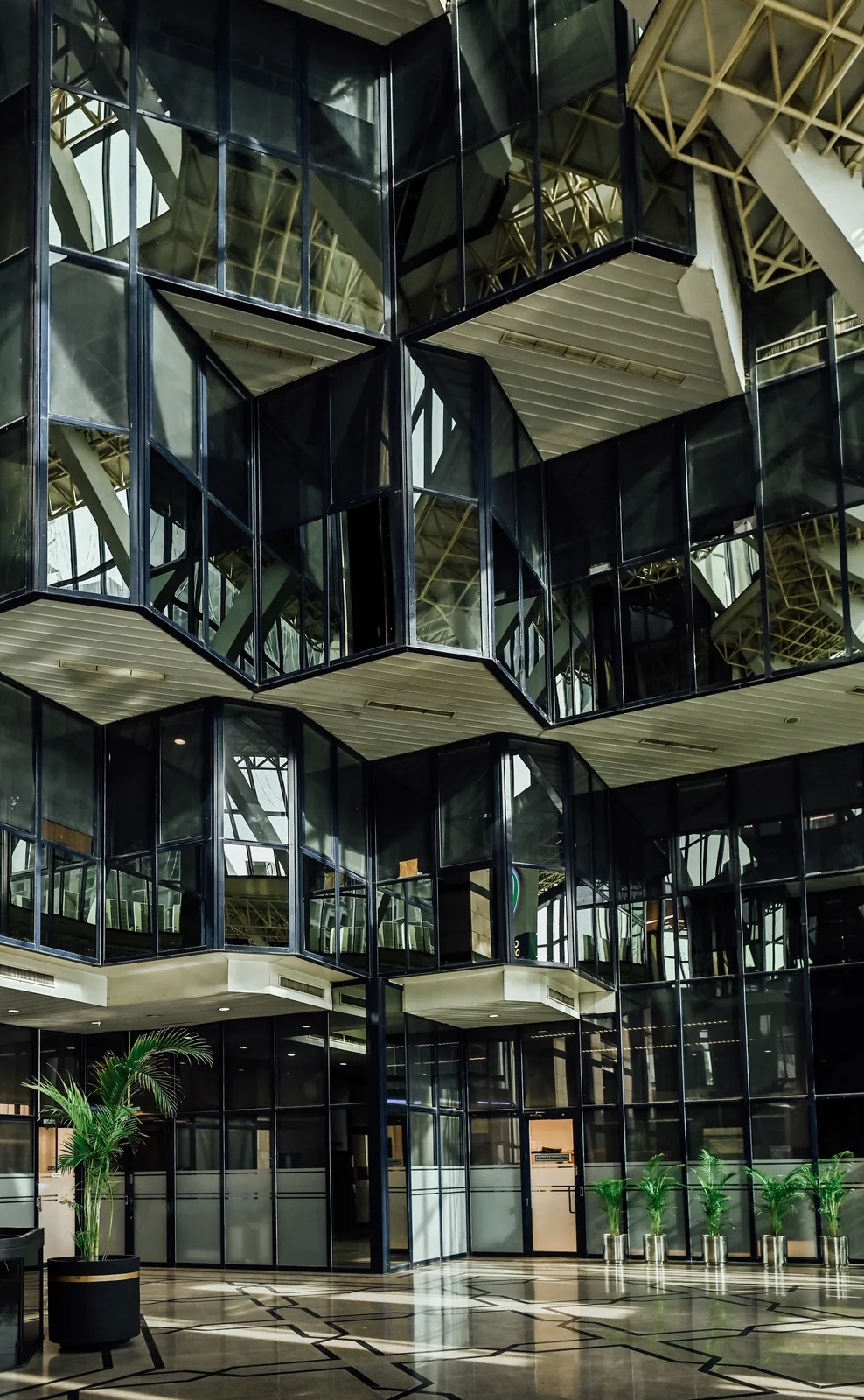 PSO House, 8th-floor rehabilitation, Karachi: PSO House atrium — building context. Building context photography.