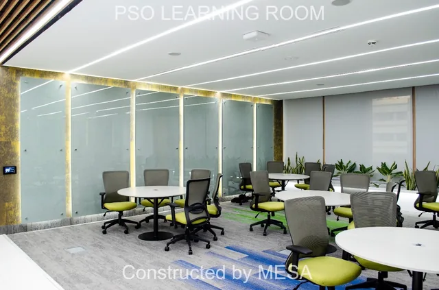 Round tables and lime-green seating beside tall textured wall panels edged with vertical light strips, with original project and MESA overlays.