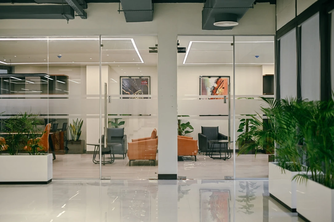 PSO 6th & 7th: Lounge seating beyond a glazed boundary. 6th–7th-floor interior photography.