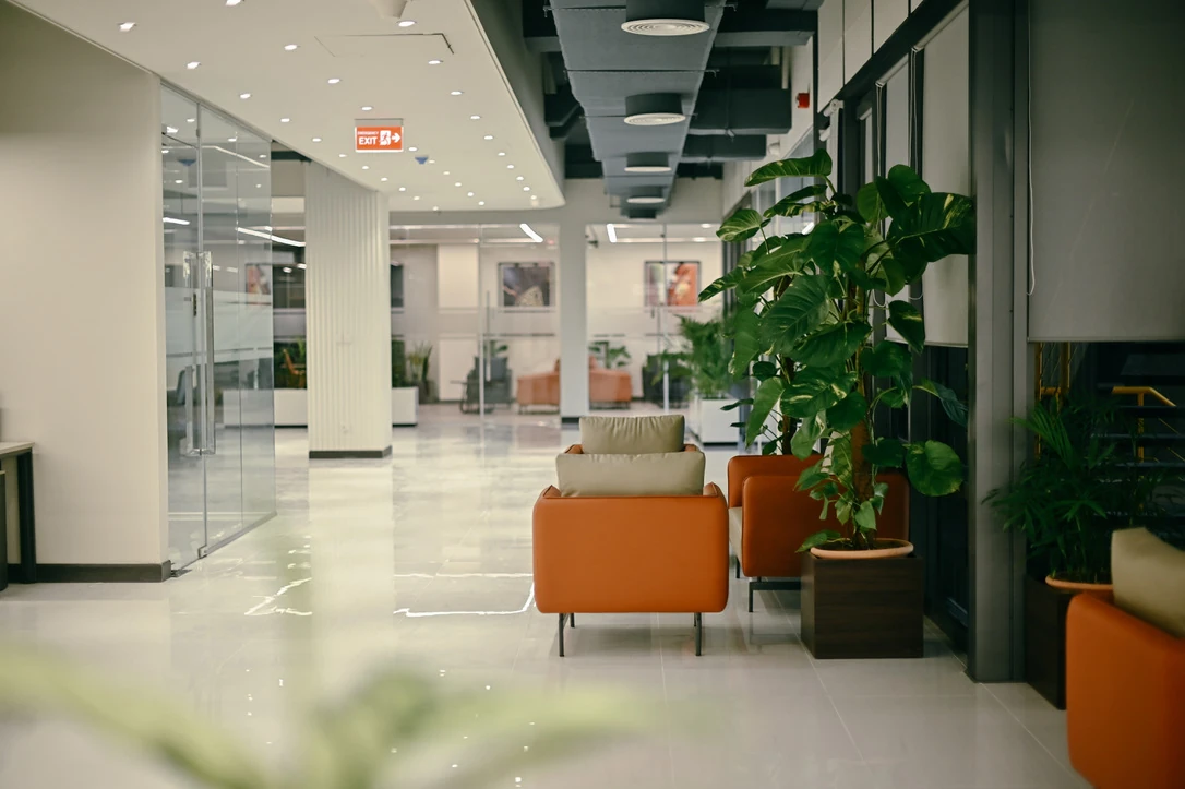 PSO 6th & 7th: Orange seating accompanies the main office route. 6th–7th-floor interior photography.