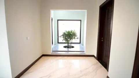 Ghalib Residence film, opening on its planted window niche.