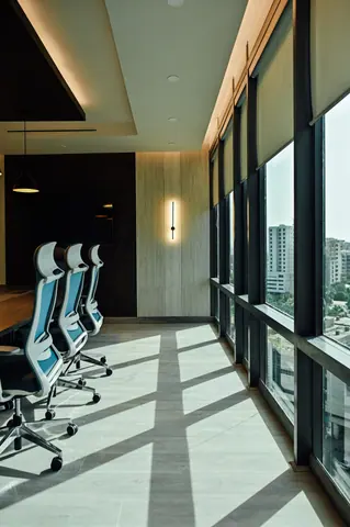PSO House, 8th-floor rehabilitation, Karachi: Strong daylight shadows beside the conference chairs. 8th-floor rehabilitation photography.