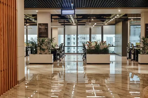 PSO House, 8th-floor rehabilitation, Karachi: A timber screen opens onto the planted office floor. 8th-floor rehabilitation photography.