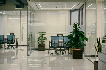 PSO 6th & 7th: Two glass-fronted rooms beside the shared floor. 6th–7th-floor interior photography.