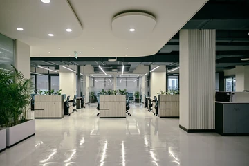 PSO 6th & 7th: A broad open area leads towards the work bays. 6th–7th-floor interior photography.
