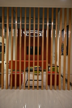 PSO 6th & 7th: Vertical timber fins reveal the colourful lounge beyond. 6th–7th-floor interior photography.