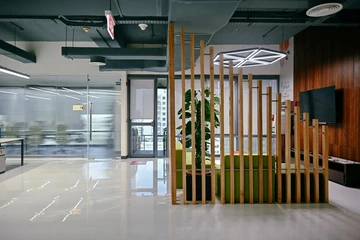 PSO 6th & 7th: A stepped timber screen wraps a small seating area. 6th–7th-floor interior photography.
